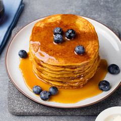 Wall Mural - Pumpkin pancakes with maple syrup and blueberries
