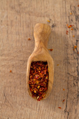 Wall Mural - dried tomatoes as spice in a wooden scoop