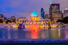 Chicago Skyline Panorama With Skyscrapers And Buckingham Fountain In Grant Park At Night Lit By Colorful Lights.