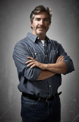 Poster - Portrait of serious man over gray wall.