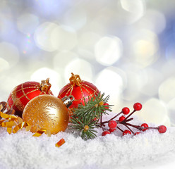 Wall Mural - Christmas decoration on snow against bright blurred background.