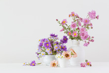Flowers  In Ceramic Vases On White Background