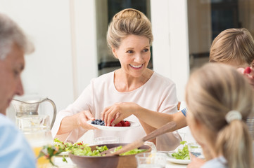 Grandmother serving food