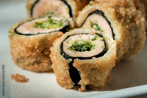 national Oriental food sushi hot rolls tempura closeup with salmon ...