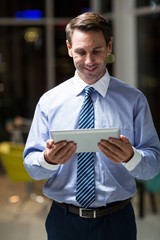 Wall Mural - Businessman using digital tablet