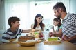© WavebreakmediaMicro - Happy family having breakfast