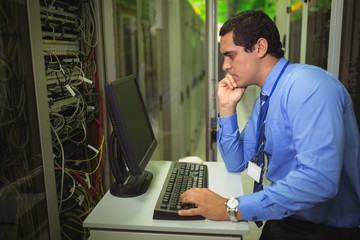 Aufkleber - Technician working on personal computer while analyzing server