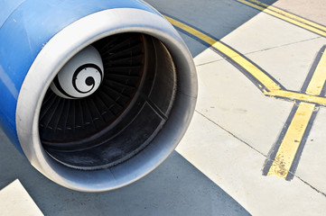 Canvas Print - Big airplane engine detail on runway