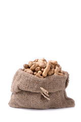 Wall Mural - peanut in sack on white background