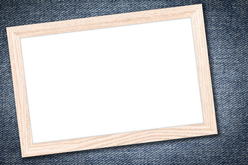 Whiteboard or Empty bulletin board with a wooden frame on denim jeans background with copy space for text or image.