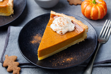 Wall Mural - Pumpkin pie, tart with whipped cream on a plate