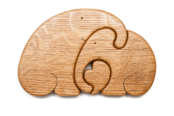 Wooden puzzle in the form of elephant family isolated on white