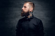© Fxquadro - Studio portrait of bearded hipster male.