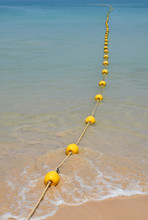 Yellow Buoys At Sea Beach And In Water