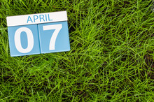 April 7th. Day 7 Of Month, Calendar On Football Green Grass Background. Spring Time, Empty Space For Text