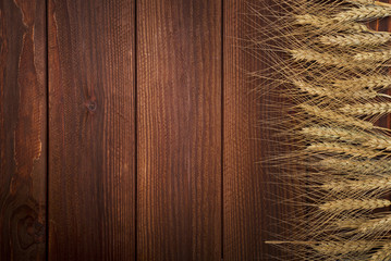 Wall Mural - wheat on wooden background. top view