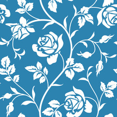 SEamless wallpaper with bloominhg roses. White flower silhouette on blue background. Floral pattern