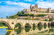 Panoramic view at the Old Bridge over Orb river with Cathedral of Saint Nazaire in Beziers - France