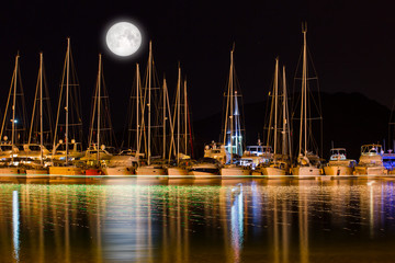 Wall Mural - Sailing boats in marina at night , Selimiye Turkey