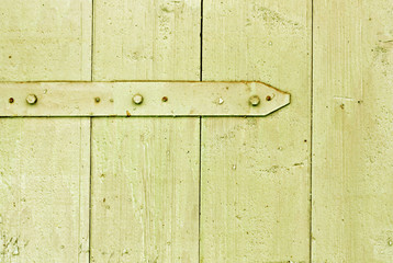 Wall Mural - Rusty metal hinge on wooden hangar door.