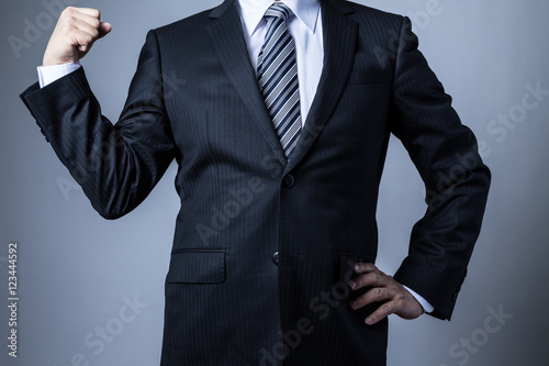スーツを着ているビジネスマン マッスルポーズ Buy This Stock Photo And Explore Similar Images At Adobe Stock Adobe Stock