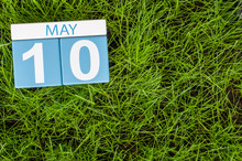 May 10th. Day 10 Of Month, Calendar On Football Green Grass Background. Spring Time, Empty Space For Text