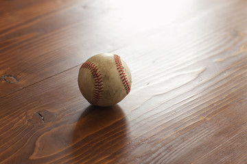 Poster - Selective focus vintage baseball on pine wood background