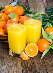 Fresh oranges on a wooden table