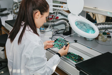 Microchip production factory. Technological process. Assembling the board. Computer and nanotechnology.