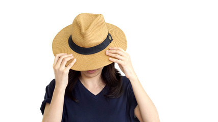 Wall Mural - Casual South East Asian girl wearing hat hiding face