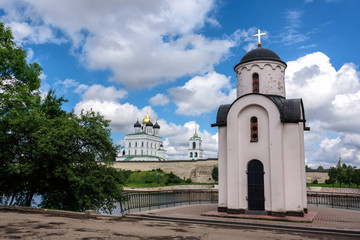 Wall Mural - View of the Pskov Kremlin and Saint Olga's chapel from Velikaya River in the summer in a sunny weather