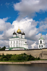 Wall Mural - View of the Pskov Kremlin from Velikaya River in the summer in a sunny weather