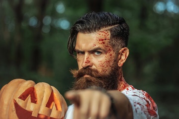 Wall Mural - halloween man with pumpkin and blood