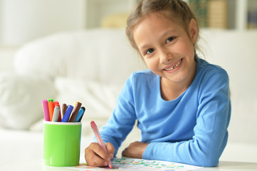 Wall Mural - portrait of little girl drawing