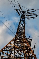 High voltage tower on a sky background