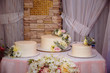 Three sweet multilevel wedding cakes decorated with blue flowers. Candy bar