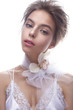 © iulskaya_photo - Beautiful girl in image of bride with flower orchid on her neck. Model with nude makeup and silk underwear. Beauty face. Photo was taken in a studio.