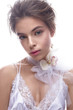 © iulskaya_photo - Beautiful girl in image of bride with flower orchid on her neck. Model with nude makeup and silk underwear. Beauty face. Photo was taken in a studio.