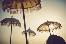 Traditional Umbrellas Against Sky During Sunset