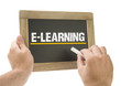 E-Learning - Hand writing on chalkboard