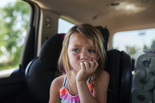 Upset Girl Looking Away While Sitting In Car