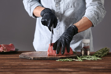 Sticker - Butcher cutting pork meat on kitchen