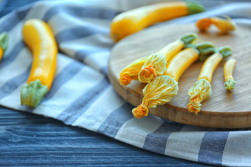 Wall Mural - Fresh yellow zucchini on wooden cutting board