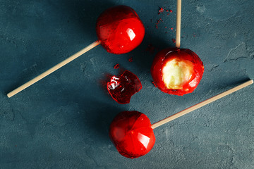 Sticker - Toffee apples on color background