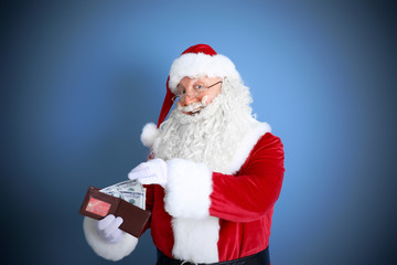 Sticker - Santa Claus holding wallet with money and credit card on blue background