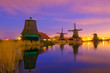 Windmills at twilight after sunset in the famous zaanse schans, Netherlands