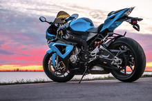 Sports Motorcycle On The Shore At Sunset