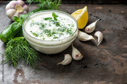 Fotografie, Obraz Tzatziki sauce ingredients cucumber garlic Healthy food backgrou