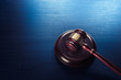 judge gavel on a blue wooden background