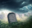 gravestone with fog and dramatic lighting